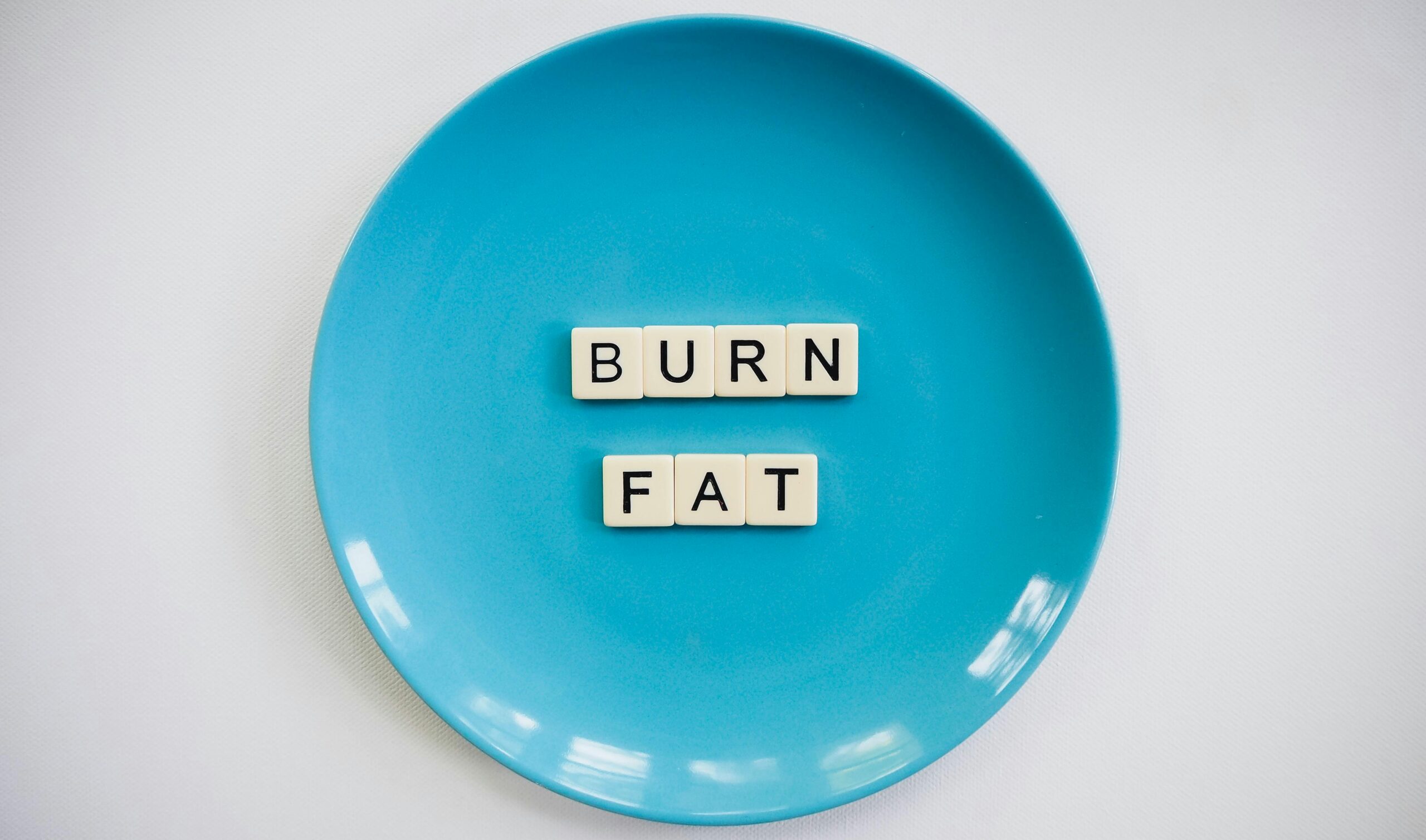 Foto Eines Burn Fat Text Auf Runder Blauer Platte